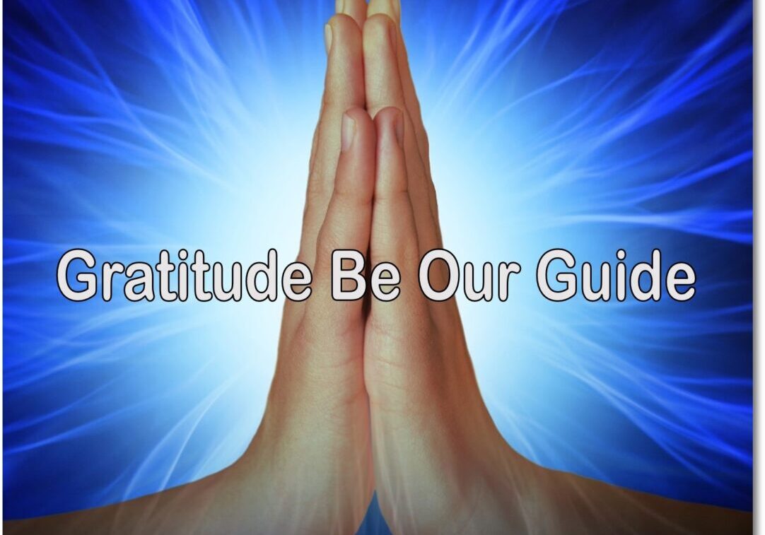 A person is praying with the words gratitude be our guide