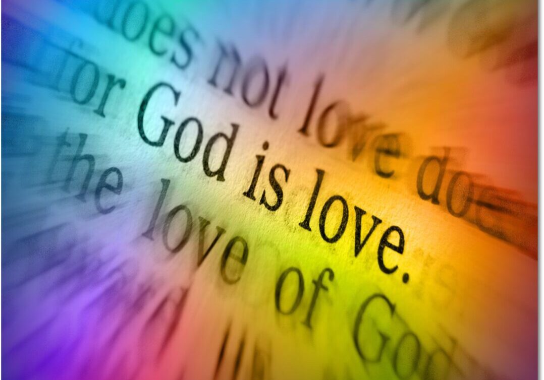 A rainbow colored background with the words god is love.